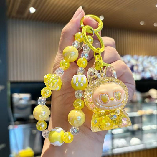 Crystal in oil, flowing sand bottle, canvas keychain